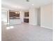 Open-concept living room flows into kitchen with stainless steel appliances and granite countertops at 4125 Lavender Ct, Lake Hamilton, FL 33851
