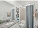 Well-lit bathroom featuring tub, shower, toilet, vanity with granite countertop and artwork at 4140 Lavender Ct, Lake Hamilton, FL 33851