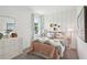 Chic bedroom with elegant accents, featuring a large window, dresser, and modern decor at 4140 Lavender Ct, Lake Hamilton, FL 33851