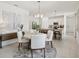 Open dining area connects to kitchen with stylish furnishings and modern lighting fixtures at 4140 Lavender Ct, Lake Hamilton, FL 33851