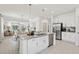 Open-concept kitchen featuring a large island, granite countertops, stainless steel appliances, and ample storage at 4140 Lavender Ct, Lake Hamilton, FL 33851