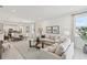 Spacious open-concept living area with dining and kitchen views, featuring stylish décor and natural light at 4140 Lavender Ct, Lake Hamilton, FL 33851