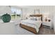 Cozy bedroom with a large window, natural light, and modern furnishings at 4140 Lavender Ct, Lake Hamilton, FL 33851