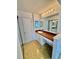 Bathroom features a vanity with a sink, a large mirror, and ample storage space at 5269 Vineland Rd # 101, Orlando, FL 32811