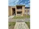 Two-story condominium with a second-floor balcony at 5269 Vineland Rd # 101, Orlando, FL 32811
