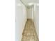 Hallway with tile flooring and closet doors at 5269 Vineland Rd # 101, Orlando, FL 32811