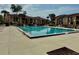 Community pool surrounded by lush landscaping, perfect for relaxation and recreation at 5269 Vineland Rd # 101, Orlando, FL 32811