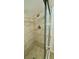 A shower with a handheld shower head, a fixed shower head, and a clear sliding door at 5269 Vineland Rd # 101, Orlando, FL 32811