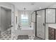 Modern bathroom with a shower featuring black trim and geometric tile, plus a large soaking tub at 5478 Nw 153Rd Ct, Morriston, FL 32668