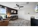 Stylish Bedroom with a modern crib, accent wall, and a cozy reading chair by a window at 5478 Nw 153Rd Ct, Morriston, FL 32668