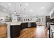Modern kitchen with dark wood cabinets, stainless steel appliances, sleek countertops, and recessed lighting at 5478 Nw 153Rd Ct, Morriston, FL 32668