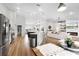Bright, open-concept space showcasing the modern kitchen and seamless transition to the inviting living area at 5478 Nw 153Rd Ct, Morriston, FL 32668