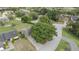 An aerial view showing the property's location and surroundings within a lush, green neighborhood at 6047 Shore Line Dr, Orlando, FL 32819