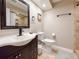 Bathroom with tile flooring, sleek black fixtures, and a framed mirror above the vanity at 6047 Shore Line Dr, Orlando, FL 32819