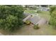 Aerial view of home with well-maintained lawn and mature trees at 6047 Shore Line Dr, Orlando, FL 32819