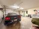 Spacious garage with concrete flooring and plenty of storage space to fit your vehicle and more at 6047 Shore Line Dr, Orlando, FL 32819