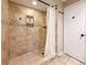 Walk-in shower featuring tiled walls, a shower head, and shelving at 6047 Shore Line Dr, Orlando, FL 32819
