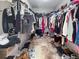 Walk-in closet with double racks for clothing, shelving, and space for shoes at 6047 Shore Line Dr, Orlando, FL 32819