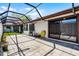 The backyard features a screened enclosure, turf and stone ground covering, and room for seating at 631 Warrenton Rd, Winter Park, FL 32792