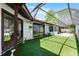 Enjoy an enclosed lanai with a screened-in pool, lush lawn, and room for outdoor living at 631 Warrenton Rd, Winter Park, FL 32792
