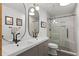 Stunning bathroom featuring double vanity, frameless shower with glass door, and modern fixtures at 631 Warrenton Rd, Winter Park, FL 32792