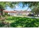 Beautiful exterior view of a single-story home with a well-maintained green lawn at 631 Warrenton Rd, Winter Park, FL 32792