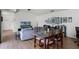 Cozy living room with a dining area, hardwood floors, and a comfortable sofa at 631 Warrenton Rd, Winter Park, FL 32792