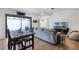 Spacious living room with a dining table, hardwood floors, and access to a patio at 631 Warrenton Rd, Winter Park, FL 32792