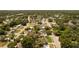 Aerial view of a well-maintained residential area, featuring tree-lined streets and neatly arranged homes at 826 Cherokee Cir, Sanford, FL 32773
