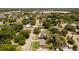 Aerial view of a neighborhood with neatly lined houses and green spaces, showcasing the community setting at 826 Cherokee Cir, Sanford, FL 32773