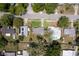 Aerial shot showcasing the property's location, nearby houses, and surrounding trees at 826 Cherokee Cir, Sanford, FL 32773