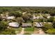 Overhead view of the home showcasing the neighborhood, backyard, and surrounding trees at 826 Cherokee Cir, Sanford, FL 32773