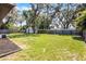 Large green backyard with shed and wooden fence, great for outdoor activities at 826 Cherokee Cir, Sanford, FL 32773