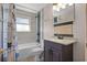 Cozy bathroom featuring a tiled shower, toilet, and single sink vanity at 826 Cherokee Cir, Sanford, FL 32773
