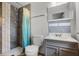 Modern bathroom with a tiled shower, toilet, and vanity sink at 826 Cherokee Cir, Sanford, FL 32773