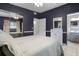 Well-lit bedroom showcasing a comfortable bed and adjoining bathroom at 826 Cherokee Cir, Sanford, FL 32773