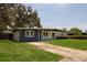 Charming single-story home with a well-manicured lawn and covered entryway at 826 Cherokee Cir, Sanford, FL 32773