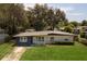 Charming single-story home with a well-manicured lawn and covered entryway at 826 Cherokee Cir, Sanford, FL 32773