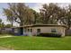 Charming single-story home with a well-manicured lawn and covered entryway at 826 Cherokee Cir, Sanford, FL 32773