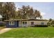 Charming single-story home with a well-manicured lawn and covered entryway at 826 Cherokee Cir, Sanford, FL 32773
