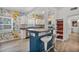 Kitchen boasting colorful floral wallpaper, modern stainless appliances, and breakfast bar seating at 826 Cherokee Cir, Sanford, FL 32773
