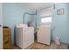 Functional laundry room with modern washer and dryer units at 826 Cherokee Cir, Sanford, FL 32773