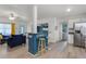 Open concept view showcasing kitchen with stainless steel appliances, breakfast bar, and seating at 826 Cherokee Cir, Sanford, FL 32773