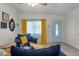Inviting living area with stylish furniture and a bright blue front door at 826 Cherokee Cir, Sanford, FL 32773