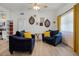 Inviting living area with stylish furniture, hardwood floors, and kitchen view at 826 Cherokee Cir, Sanford, FL 32773