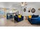 Inviting living area with stylish furniture, hardwood floors, and kitchen view at 826 Cherokee Cir, Sanford, FL 32773
