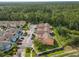 Villas at Island Club aerial view shows condominiums surrounded by trees at 8704 Knightsbridge Ct # B, Kissimmee, FL 34747