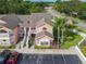 Aerial view of condos featuring multiple stories, staircases, and lawns at 8704 Knightsbridge Ct # B, Kissimmee, FL 34747