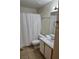Standard bathroom featuring a shower with curtain, toilet, and sink with vanity at 8704 Knightsbridge Ct # B, Kissimmee, FL 34747
