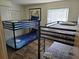 Bright bedroom with multiple bunk beds, offering ample sleeping space for Gathering or guests at 8704 Knightsbridge Ct # B, Kissimmee, FL 34747
